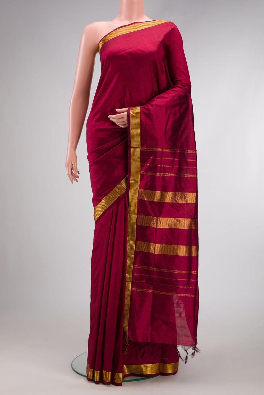 Maroon Dual Tone Kanjivaram Silk Nine Yards Saree with Plain Body and Zari Border.  displayed on a mannequin