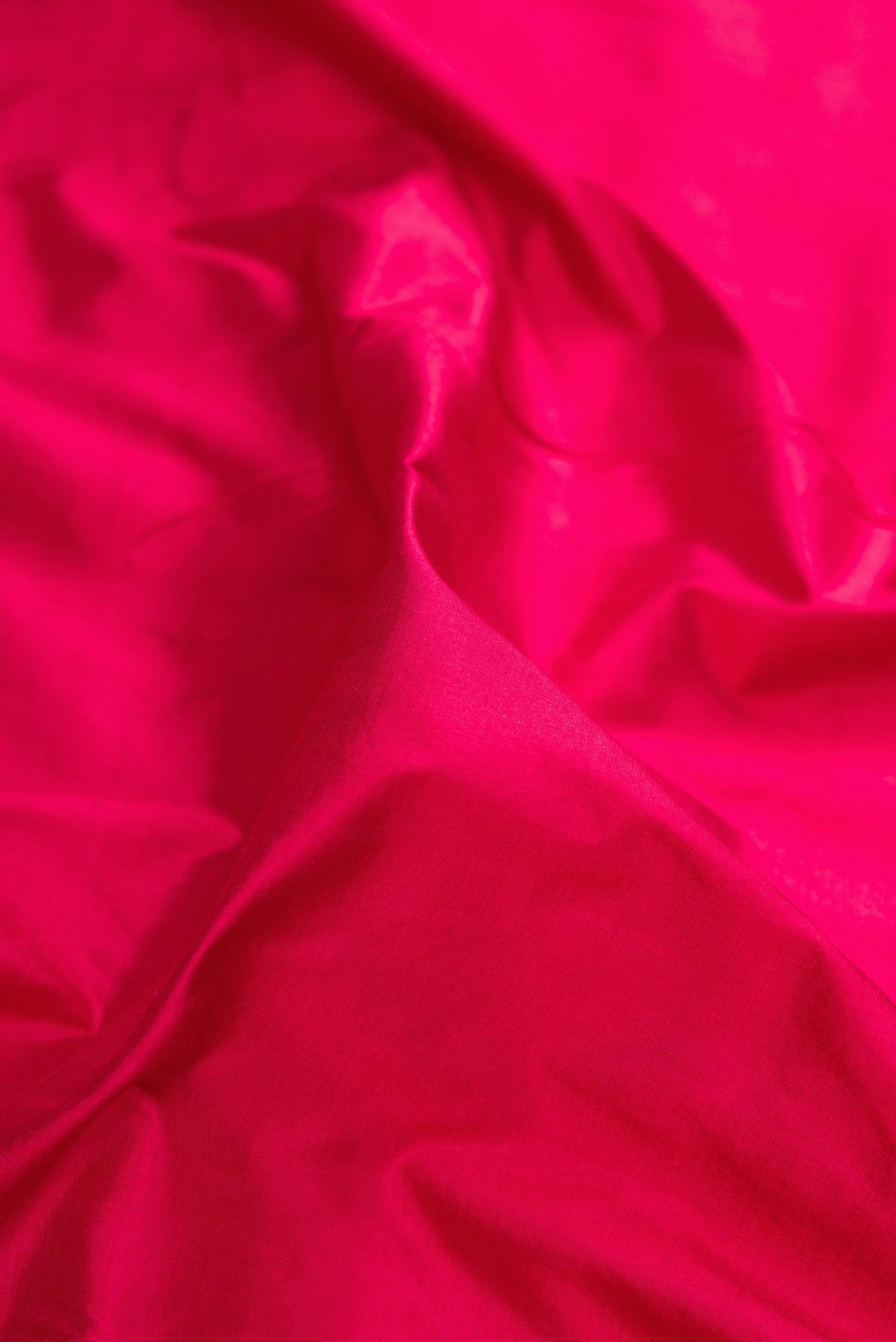 Close up of Maroon Kanchipuram Silk Nine Yards Saree with Plain Body and Zari Border.  displaying folds