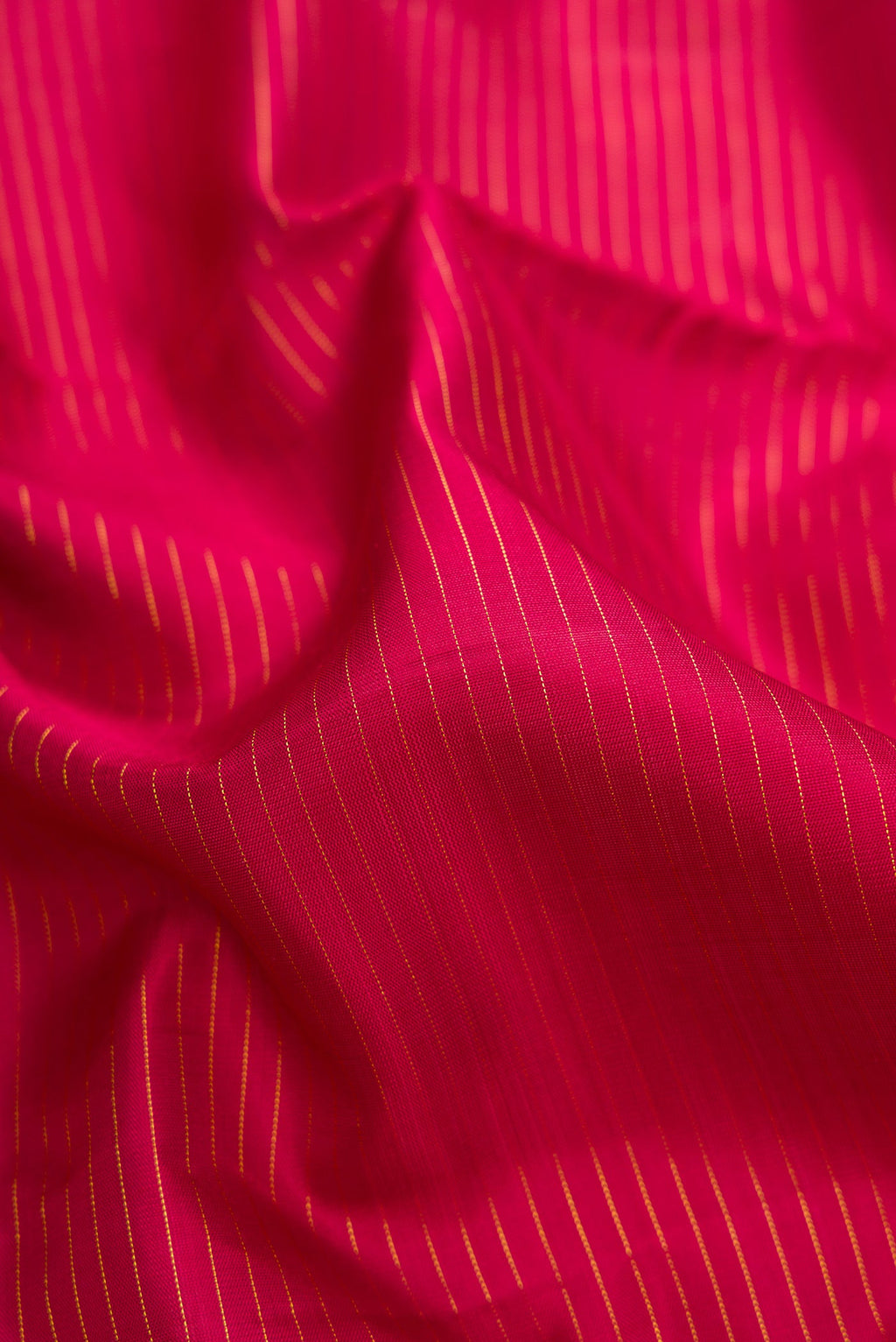 Close up of Pure Silk Pure Zari Maroon Dual Tone Kanjivaram Nine Yards Saree with Stripes on the body and Zari Border.  displaying folds
