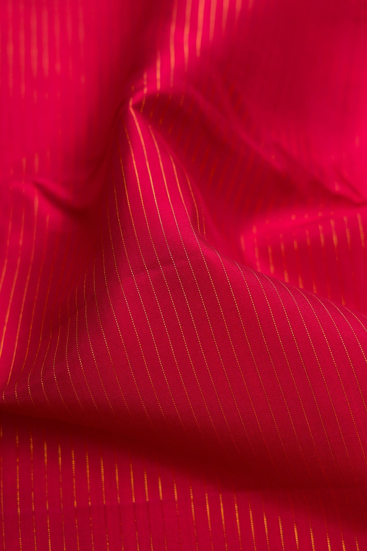 Close up of Pure Silk Pure Zari Maroon Dual Tone Kanchipuram Nine Yards Saree with Plain Body and Zari Border.  displaying folds