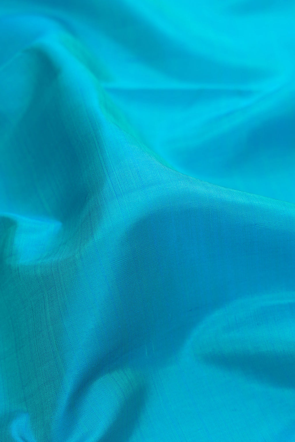 Close up of Pure Silk Pure Zari Sky Blue Dual Tone Kanchipuram Nine Yards Saree with Plain Body and Zari Border.  displaying folds