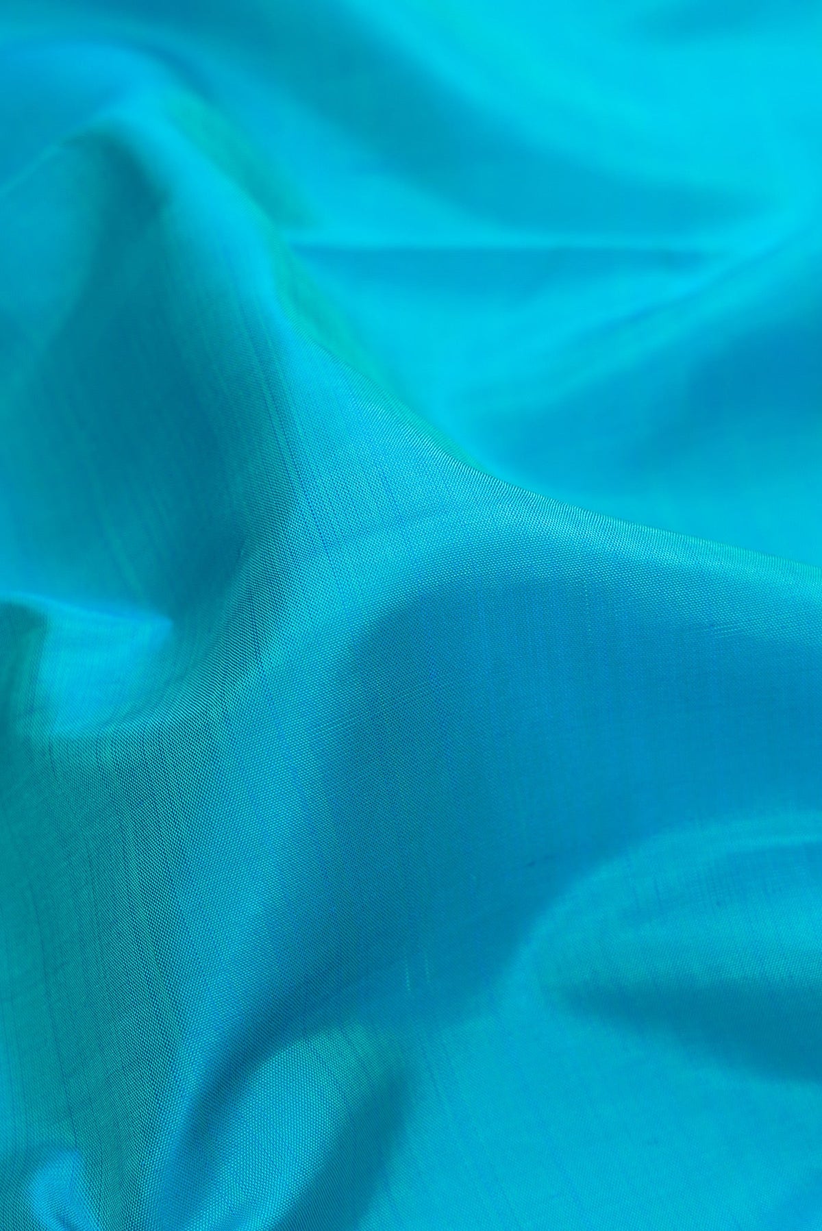 Close up of Pure Silk Pure Zari Sky Blue Dual Tone Kanchipuram Nine Yards Saree with Plain Body and Zari Border.  displaying folds