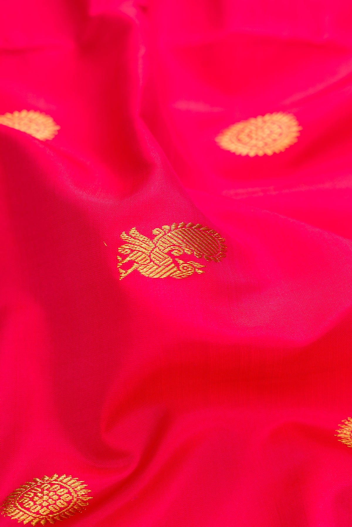 Close up of Pure Silk Pure Zari Dark Pink Dual Tone Kanchipuram Nine Yards Saree with Zari Butta on the body and Zari Border.  displaying folds