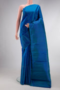 Pure Silk Pure Zari Peacock Blue Dual Tone Kanchipuram Saree with Zari Butta on the body and Zari Border.  displayed on a mannequin
