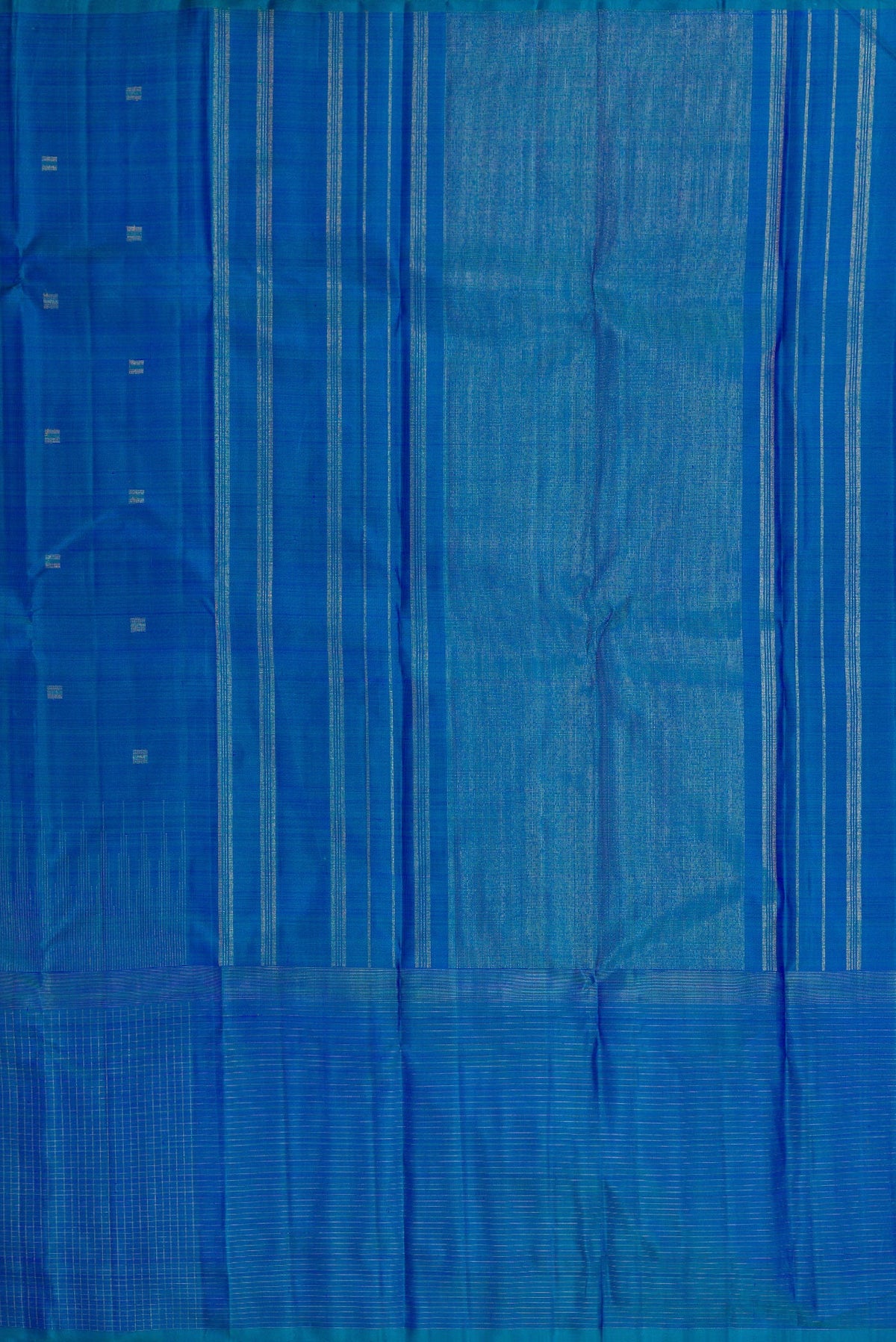 Close up image of the pallu of Pure Silk Pure Zari Peacock Blue Dual Tone Kanchipuram Saree with Zari Butta on the body and Zari Border. 