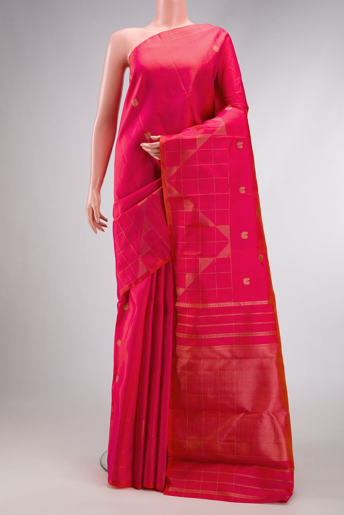 Pure Silk Pure Zari Coral Dual Tone Kanchipuram Saree with Zari Butta on the body and Fancy Border.  displayed on a mannequin
