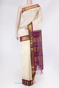 Off White Silk Cotton Saree with Plain Body and Zari Border.  displayed on a mannequin