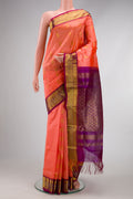 Golden Peach Dual Tone Silk Cotton Saree with Zari Butta on the body and Zari Border.  displayed on a mannequin