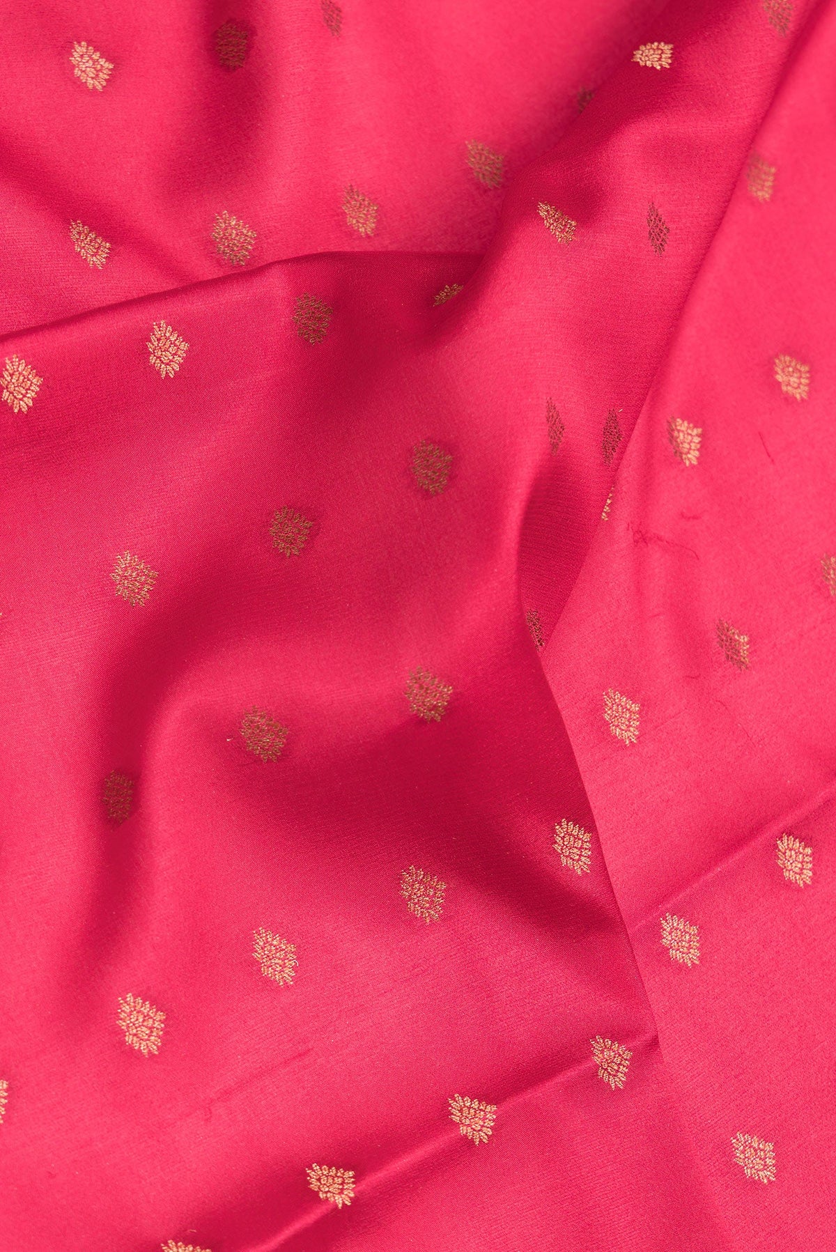 Close up of Dark Pink Dual Tone Mysore Silk Saree with Zari Butta on the body and Zari Border.  displaying folds