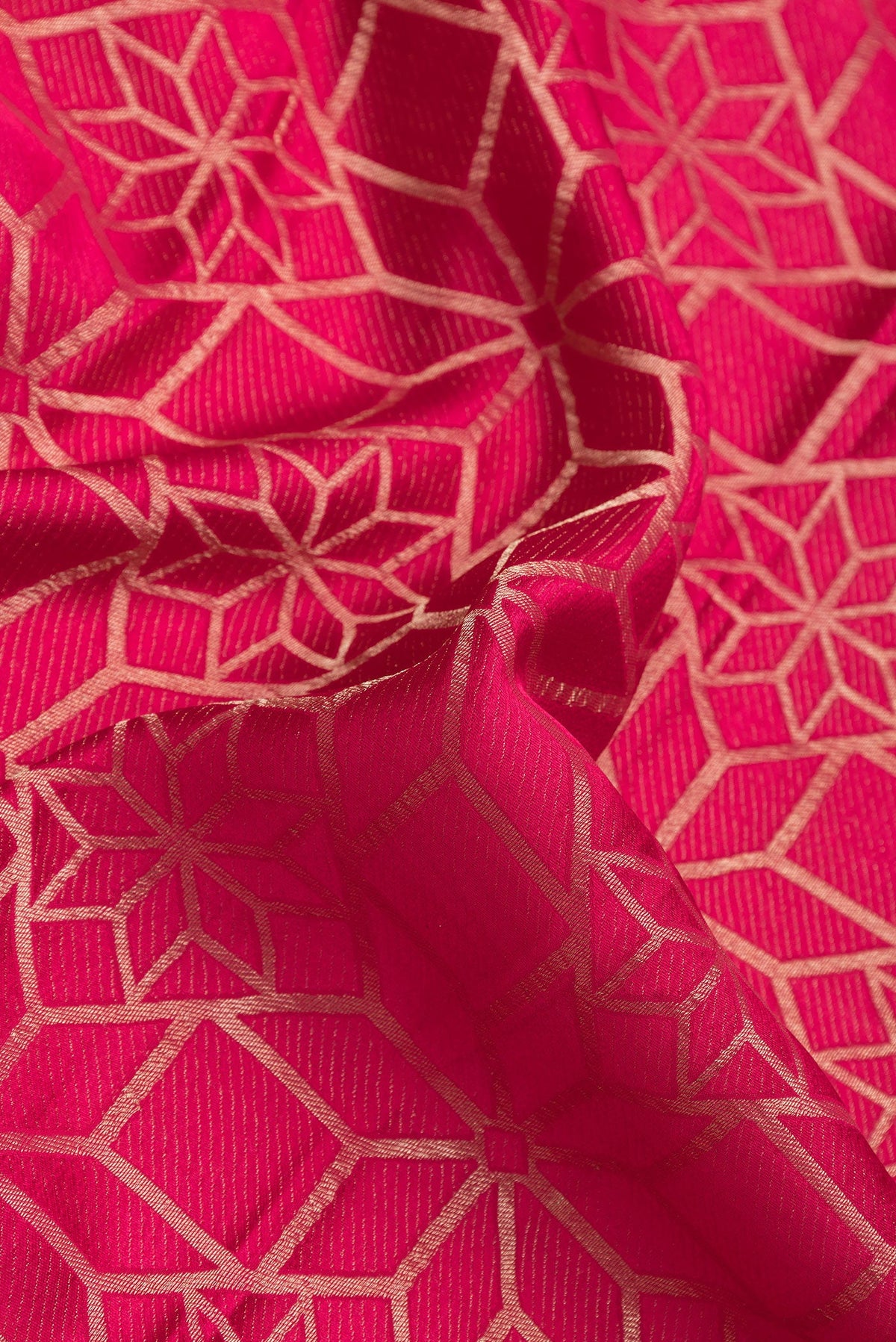 Close up of Pink Dual Tone Mysore Crepe Saree with Zari Brocade on the body and Zari Border.  displaying folds