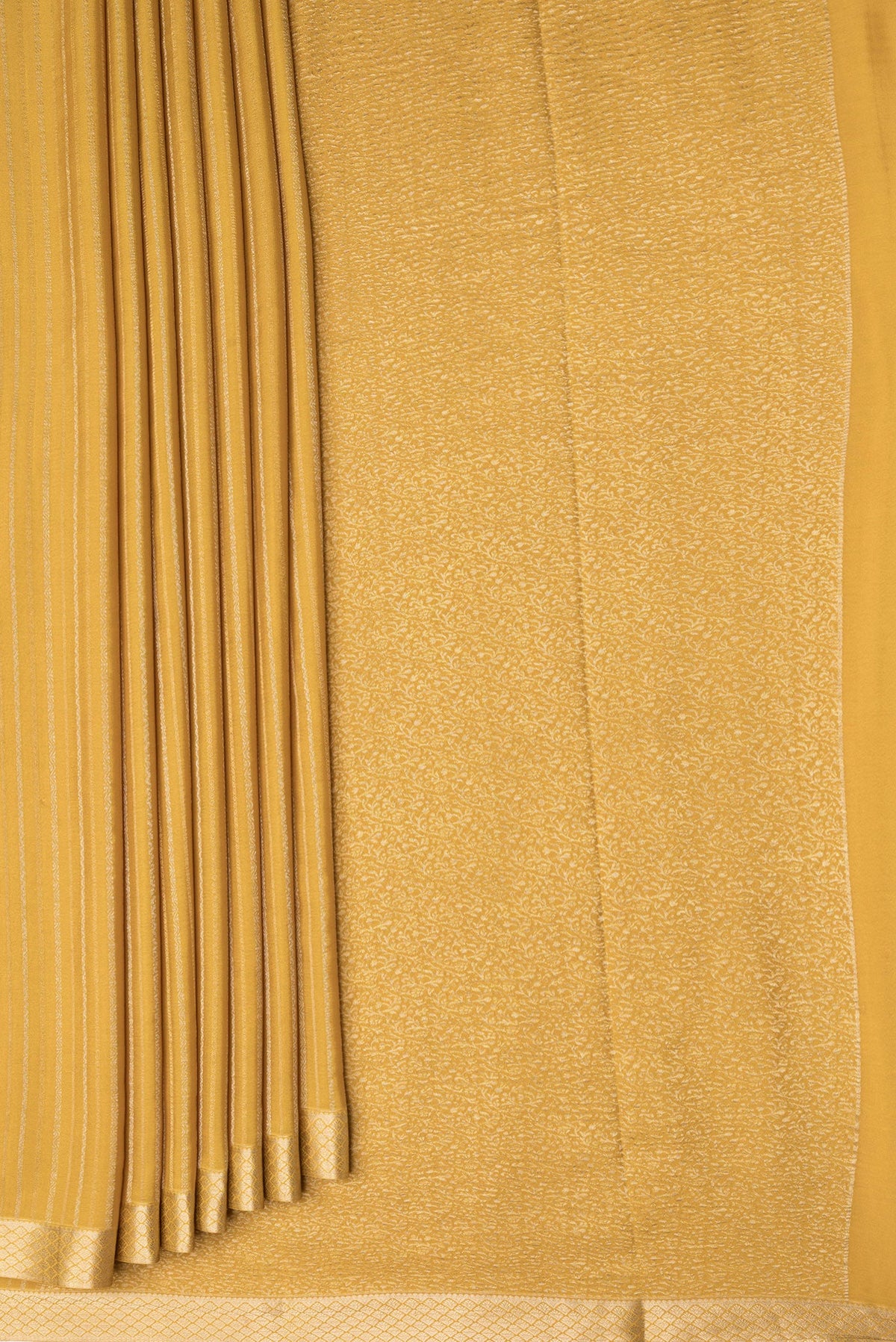 Pleats and pallu of Mustard Dual Tone Banarasi Georgette Saree with Stripes on the body and Zari Border. 