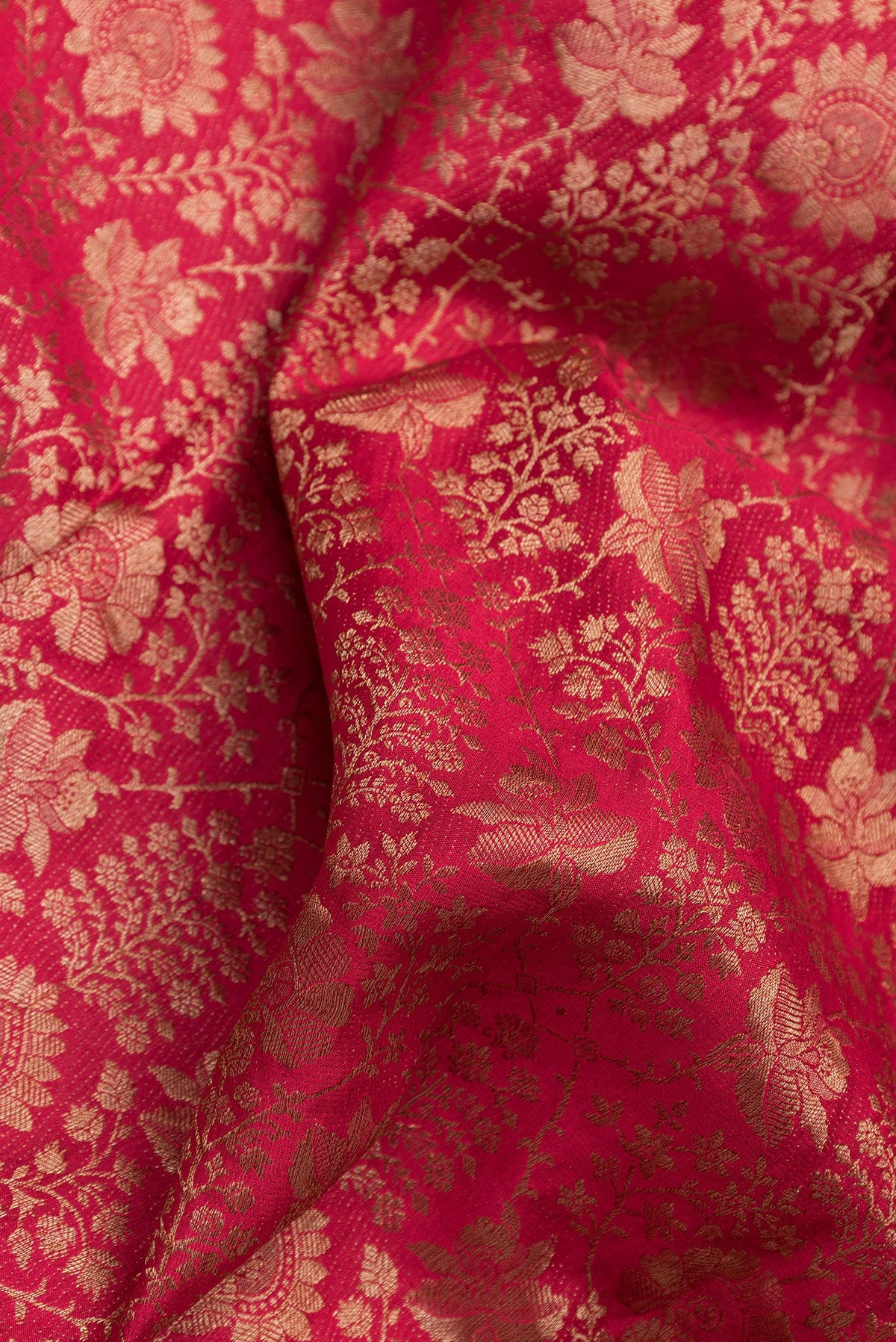 Close up of Pink Dual Tone Mysore Crepe Saree with Zari Brocade on the body and Zari Border.  displaying folds