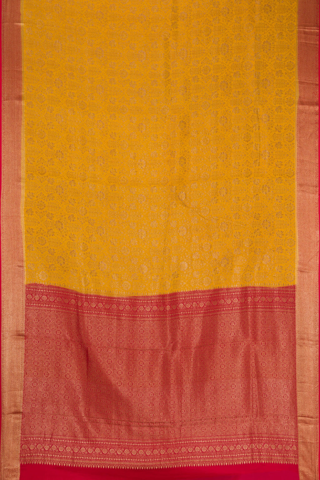 Flat view of Mustard Mysore Crepe Saree with Zari Brocade on the body and Zari Border. 