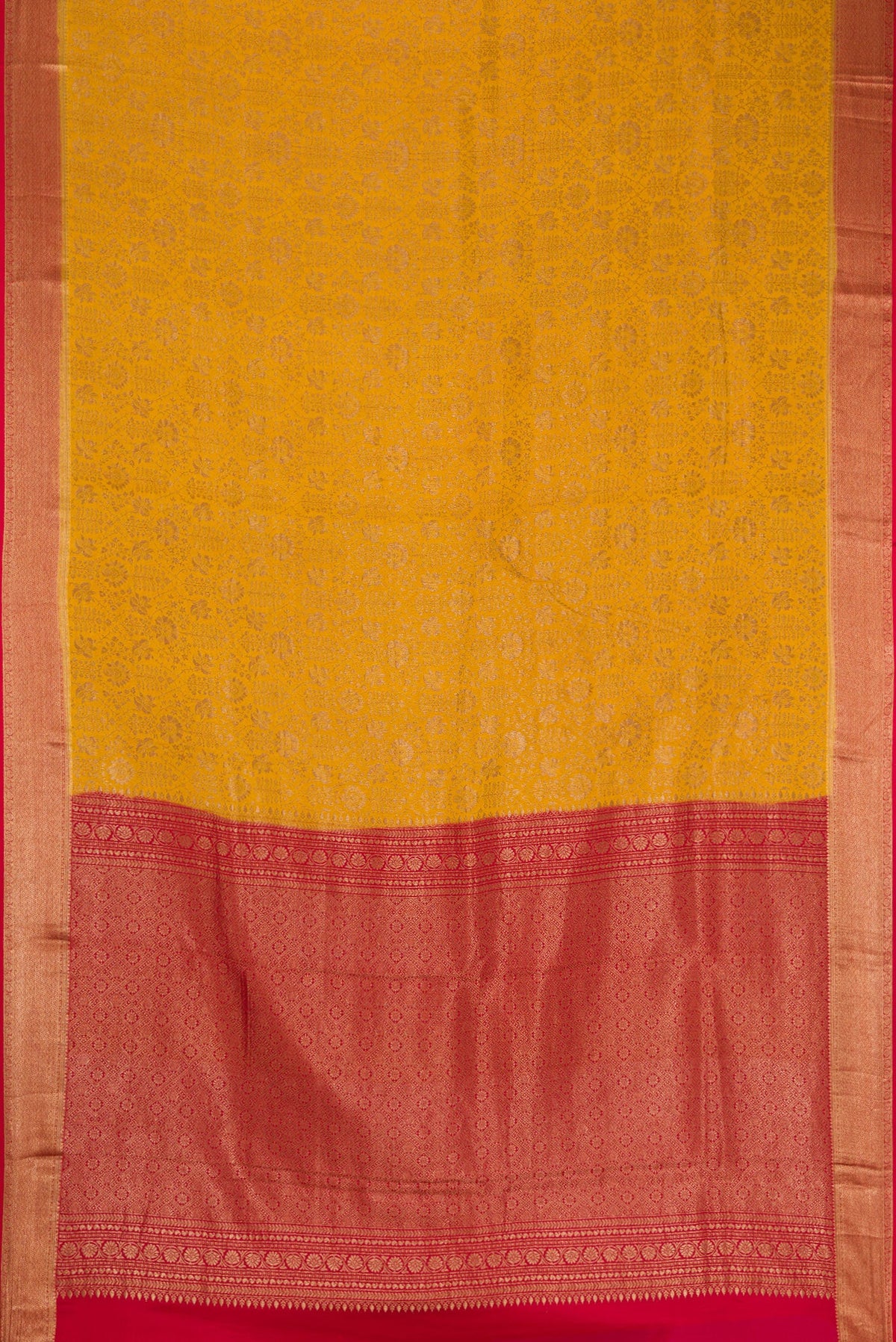Flat view of Mustard Mysore Crepe Saree with Zari Brocade on the body and Zari Border. 