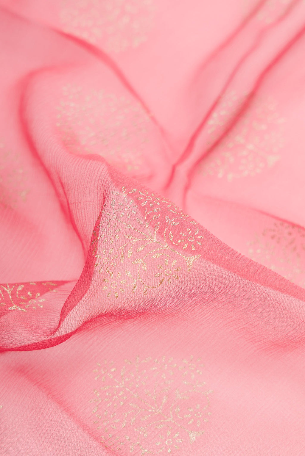 Close up of Pink Dual Tone Mysore Chiffon Saree with Zari Butta on the body and Zari Border.  displaying folds