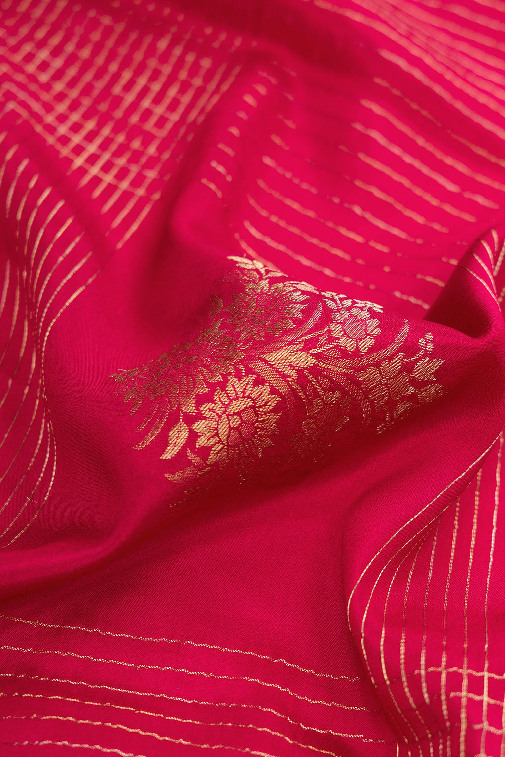 Close up of Red Dual Tone Mysore Crepe Saree with Checked design on the body and Zari Border.  displaying folds