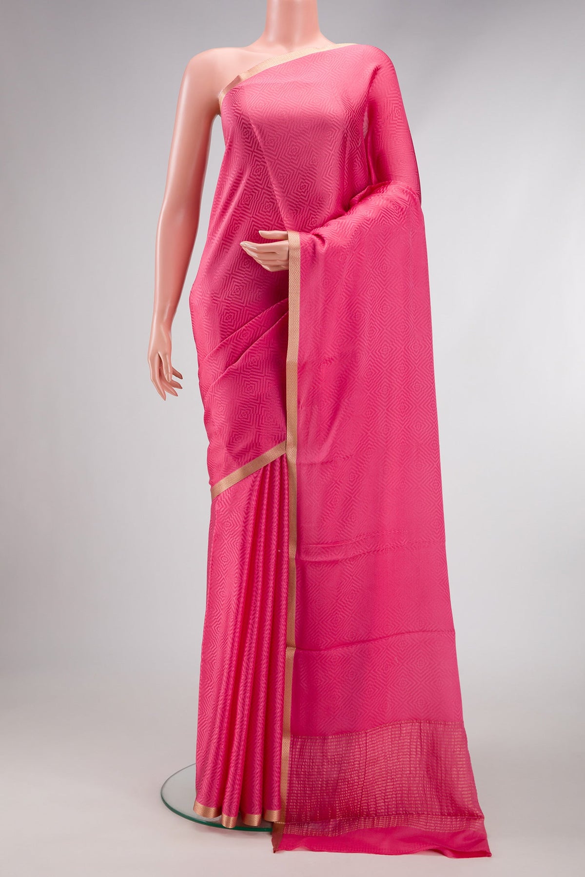 Pink Dual Tone Georgette Saree with Jacquard design on the body and Zari Border.  displayed on a mannequin