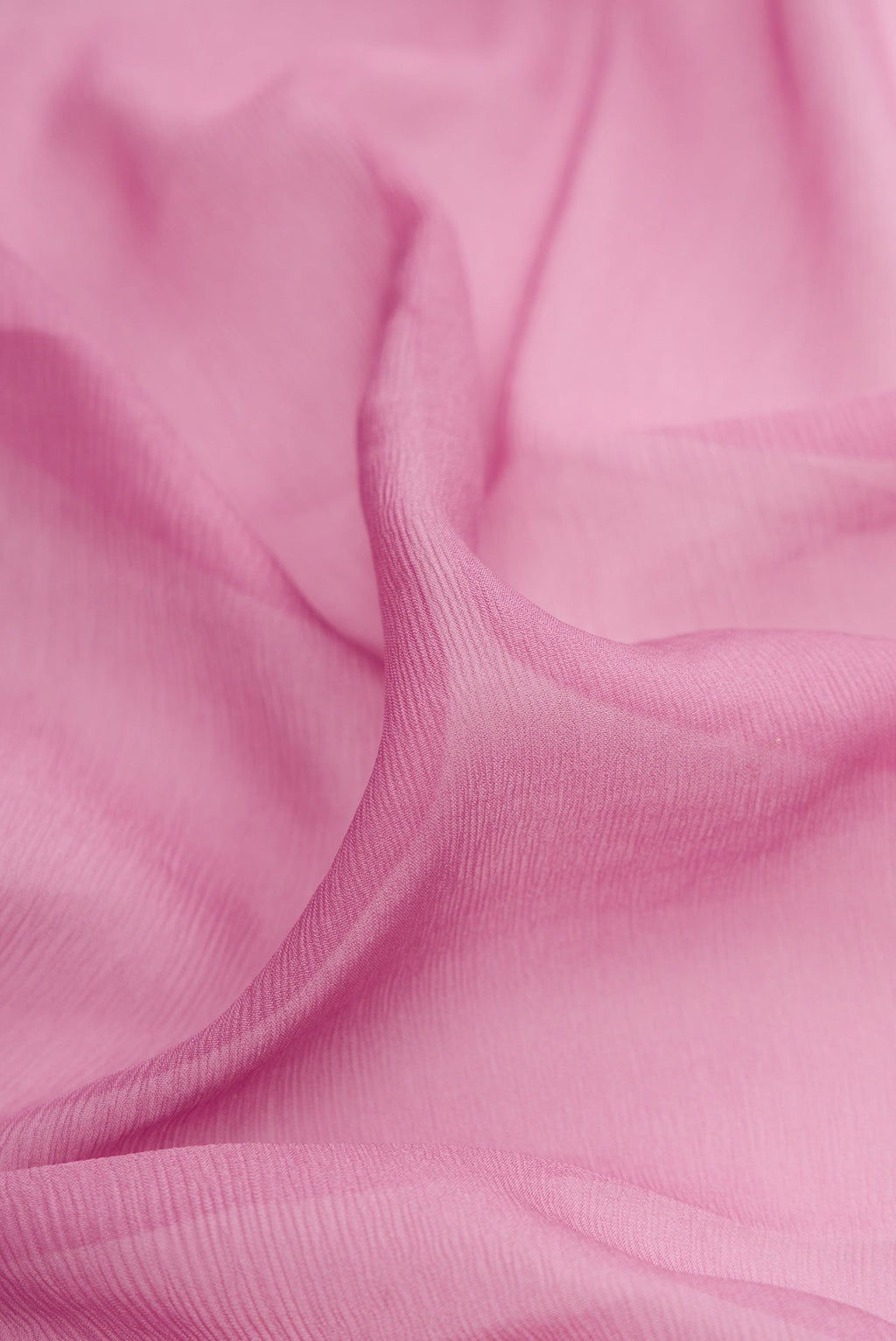 Close up of Lavender Chiffon Saree with Plain Body and Zari Border.  displaying folds