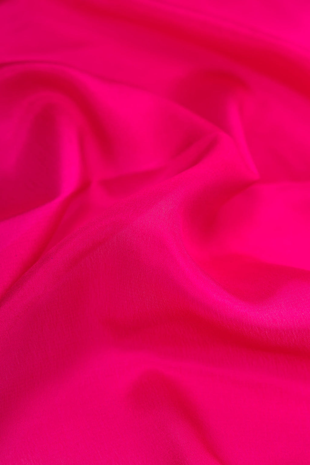 Close up of Magenta Dual Tone Mysore Silk Saree with Plain Body and Fancy Border.  displaying folds