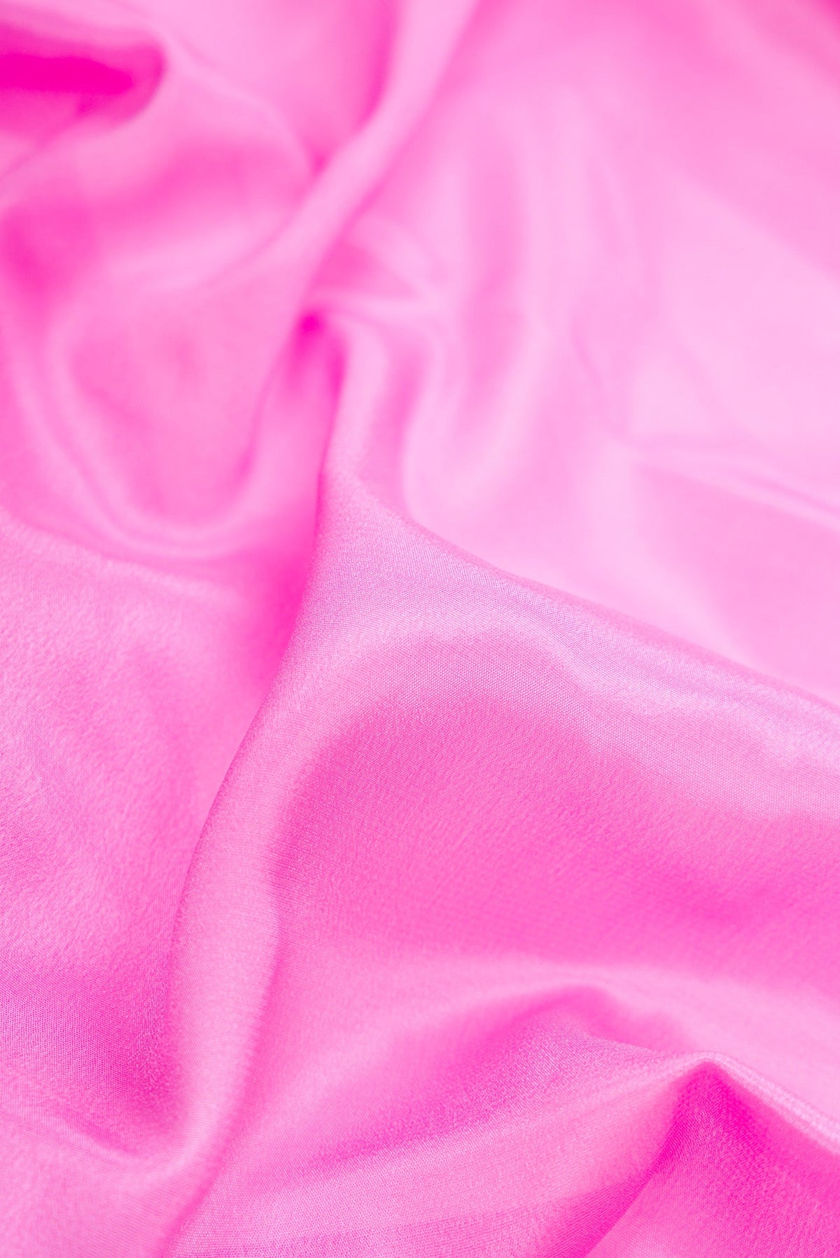 Close up of Pink Dual Tone Mysore Silk Saree with Plain Body and Fancy Border.  displaying folds