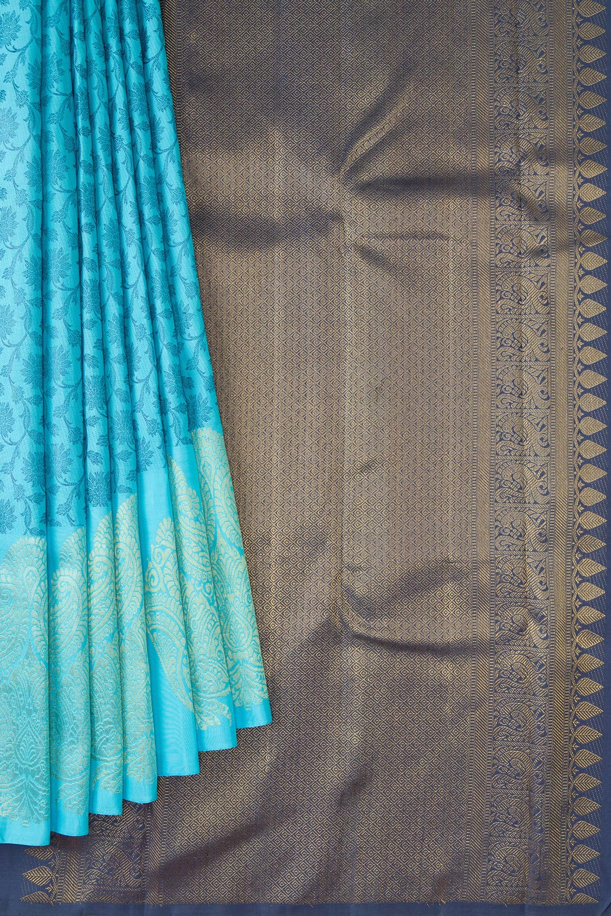Pleats and pallu of Sky Blue Dual Tone Kanjivaram Silk Saree with Zari Butta on the body and Fancy Border. 