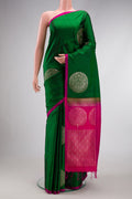Green Dual Tone Soft Silk Saree with Zari Butta on the body and Plain Border.  displayed on a mannequin