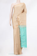 Beige Soft Silk Saree with Zari Butta on the body and Zari Border.  displayed on a mannequin