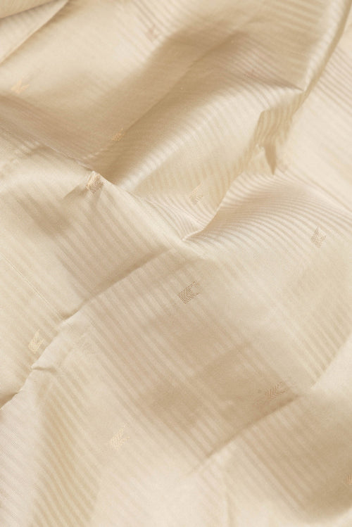 Close up of Beige Kanchipuram Silk Saree with Stripes on the body and Zari Border.  displaying folds