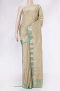 Beige Kanchipuram Silk Saree with Stripes on the body and Zari Border.  displayed on a mannequin