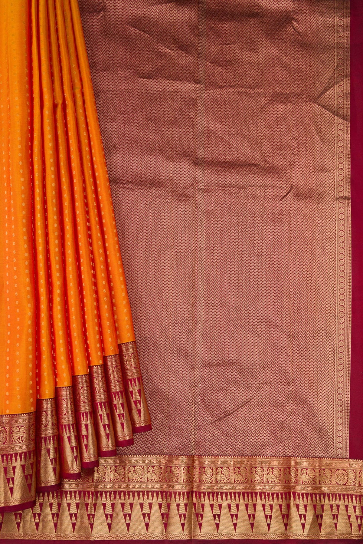 Pleats and pallu of Mustard Dual Tone Kanchipuram Silk Saree with Zari Butta on the body and Fancy Border. 
