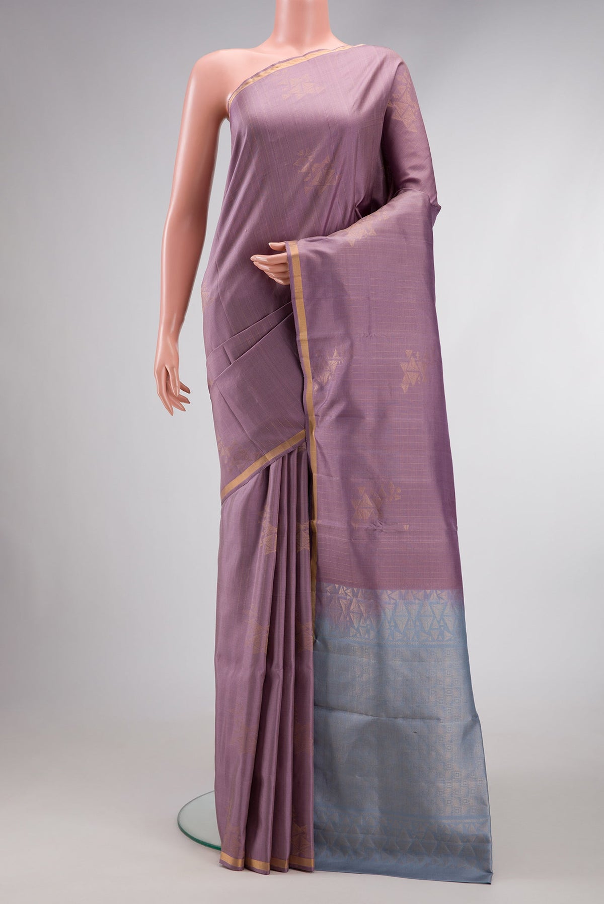 Lilac Dual Tone Soft Silk Saree with Zari Butta on the body and Zari Border.  displayed on a mannequin