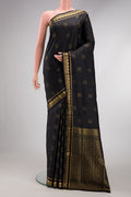 Black Dual Tone Soft Silk Saree with Zari Butta on the body and Fancy Border.  displayed on a mannequin