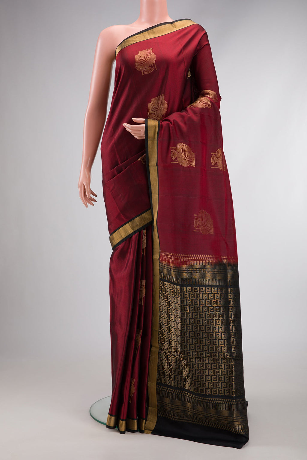 Maroon Dual Tone Soft Silk Saree with Zari Butta on the body and Zari Border.  displayed on a mannequin