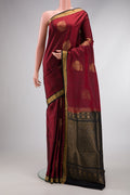 Maroon Dual Tone Soft Silk Saree with Zari Butta on the body and Zari Border.  displayed on a mannequin