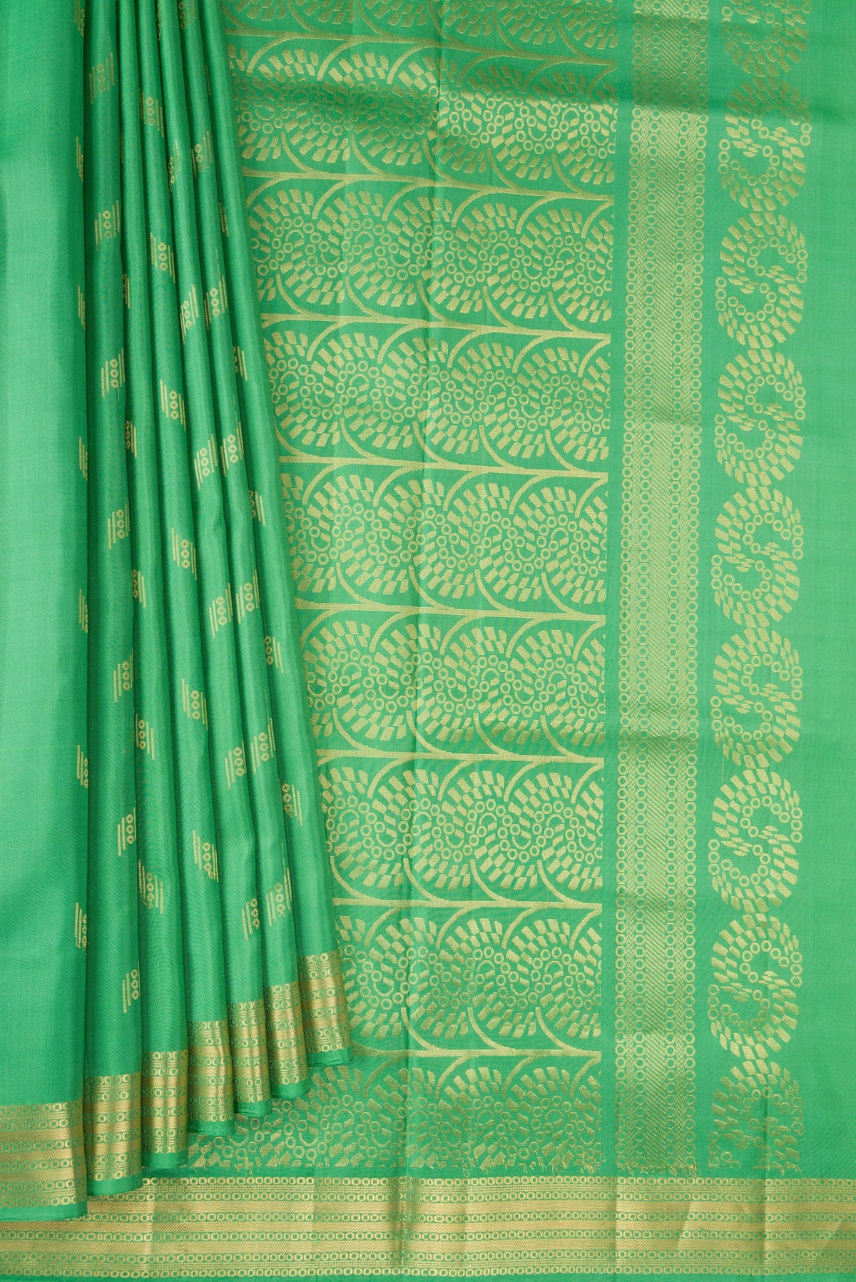 Pleats and pallu of Pista Green Dual Tone Soft Silk Saree with Zari Butta on the body and Zari Border. 