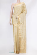 Beige Soft Silk Saree with Zari Butta on the body and Zari Border.  displayed on a mannequin
