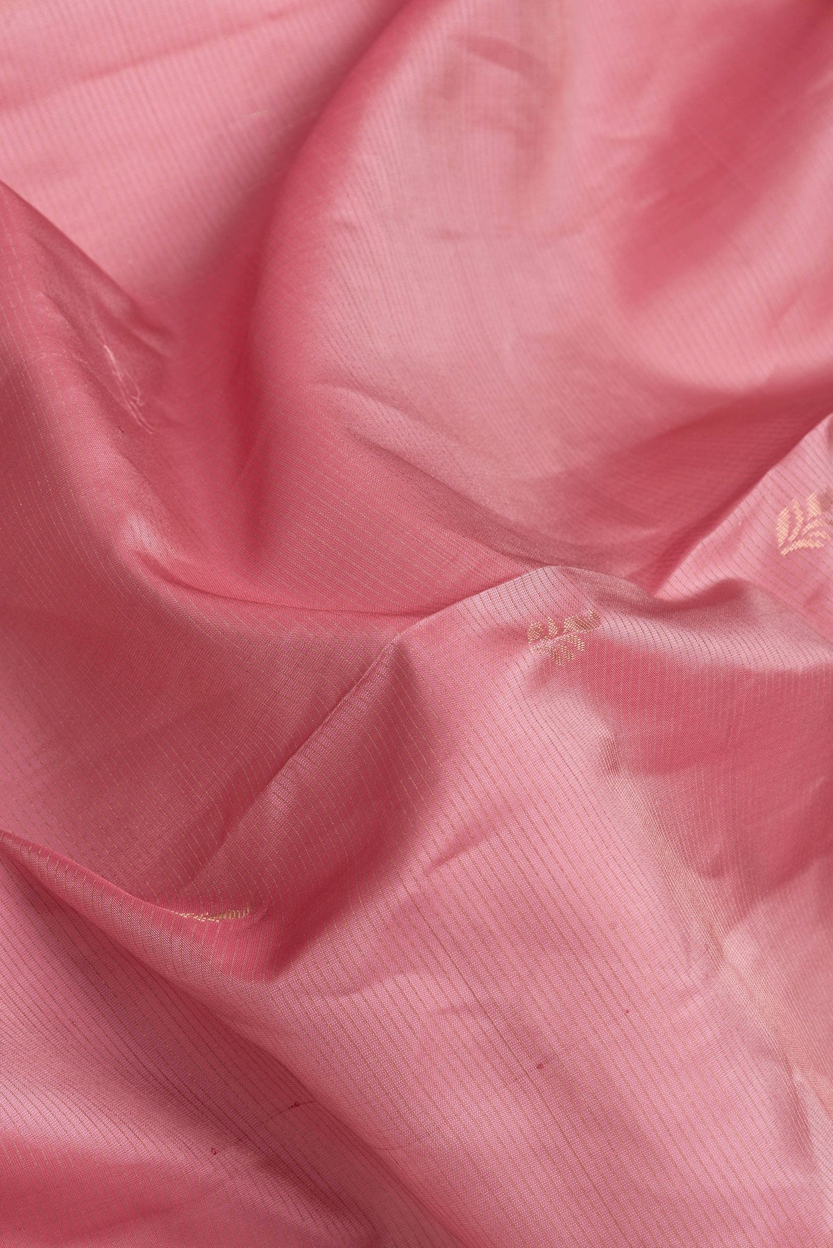 Close up of Pink Dual Tone Soft Silk Saree with Stripes on the body and Fancy Border.  displaying folds