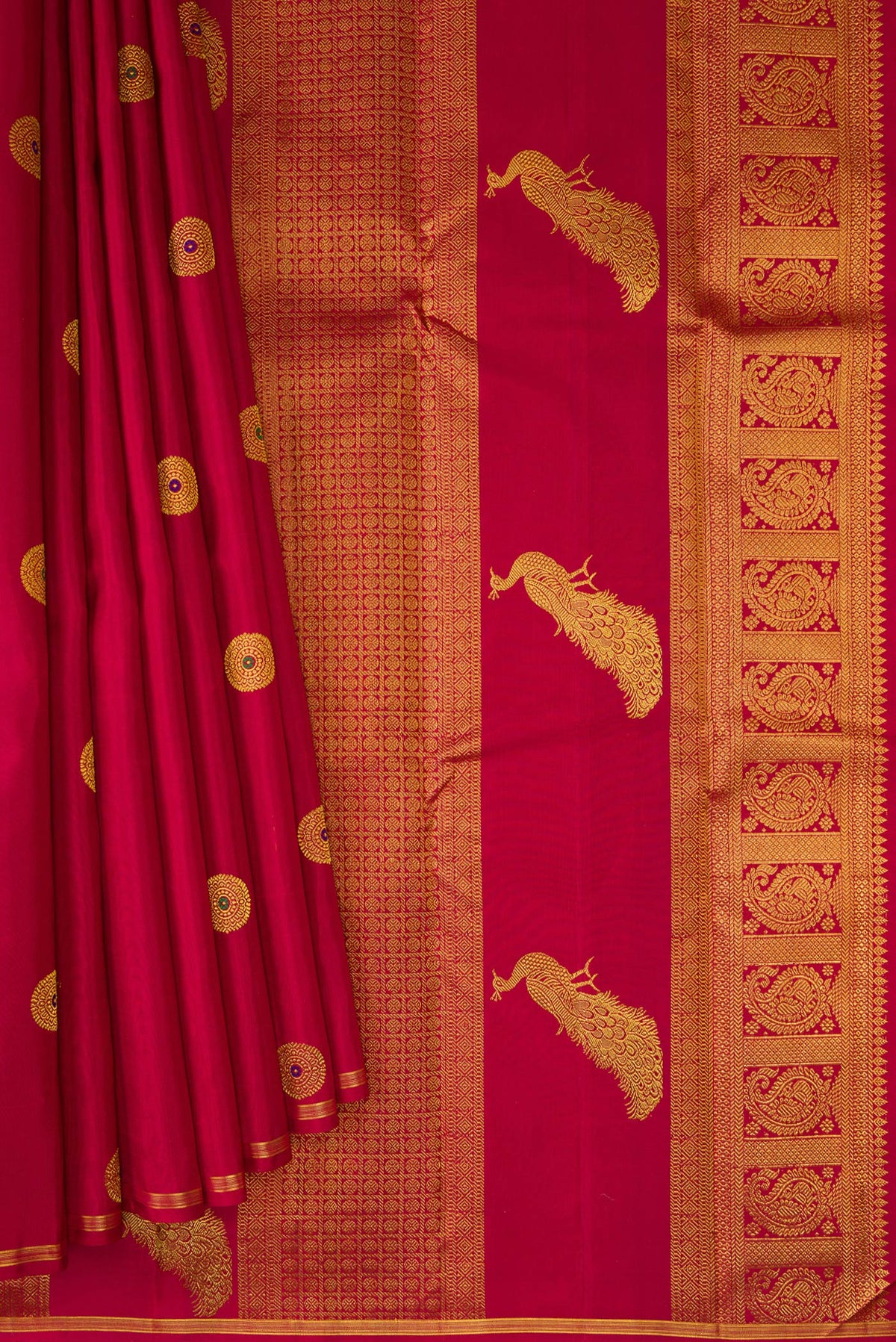 Pleats and pallu of Maroon Kanchipuram Silk Saree with Zari And Thread Butta on the body and Thin Zari Line. 