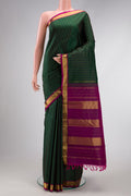 Bottle Green Dual Tone Kanchipuram Silk Saree with Stripes on the body and Zari Border.  displayed on a mannequin
