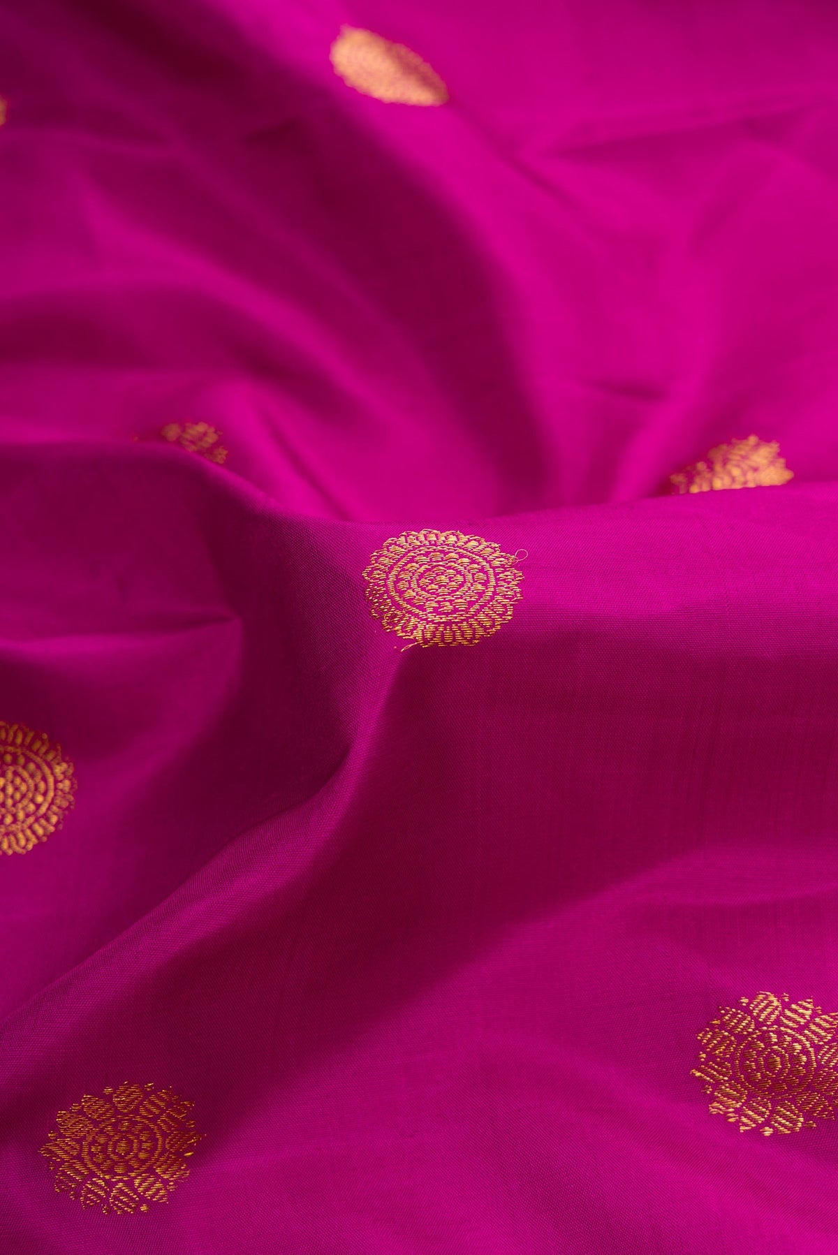 Close up of Purple Dual Tone Kanjivaram Silk Saree with Zari Butta on the body and Zari Border.  displaying folds