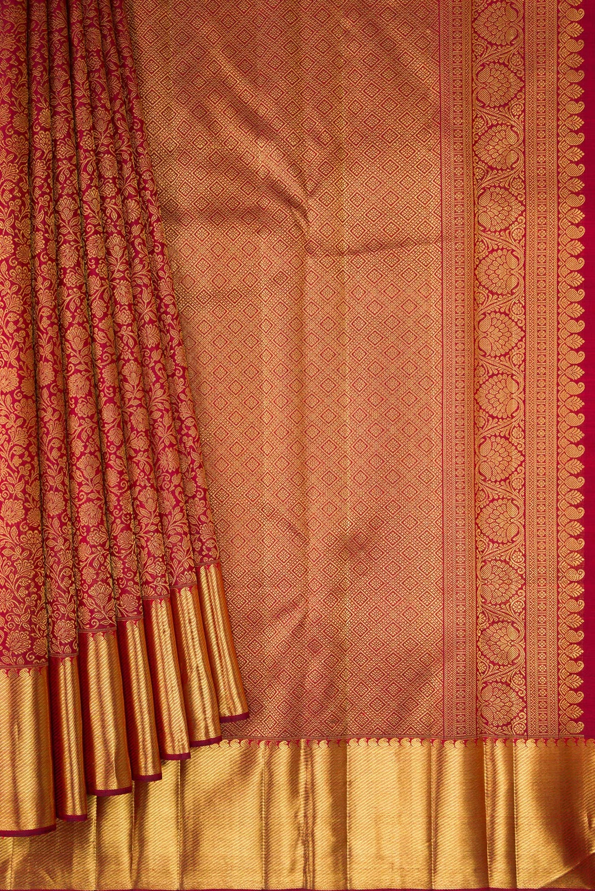 Pleats and pallu of Pure Silk Pure Zari Maroon Kanjivaram Saree with Zari Brocade on the body and Zari Border. 