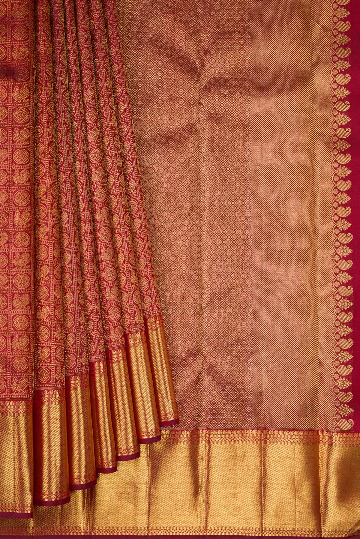 Pleats and pallu of Pure Silk Pure Zari Maroon Kanjivaram Saree with Zari Brocade on the body and Zari Border. 