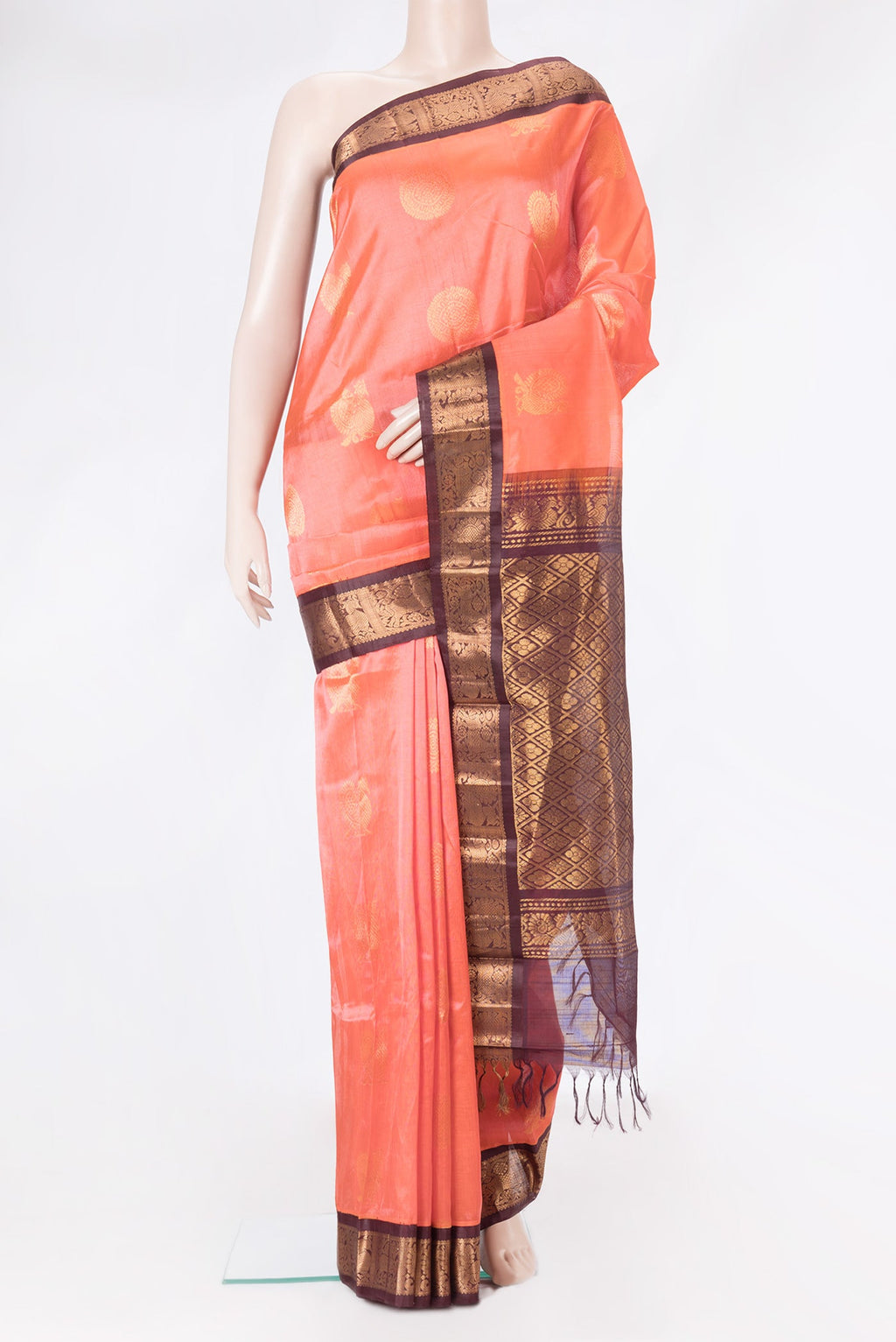 Peach Dual Tone Silk Cotton Saree with Zari Butta on the body and Zari Border.  displayed on a mannequin