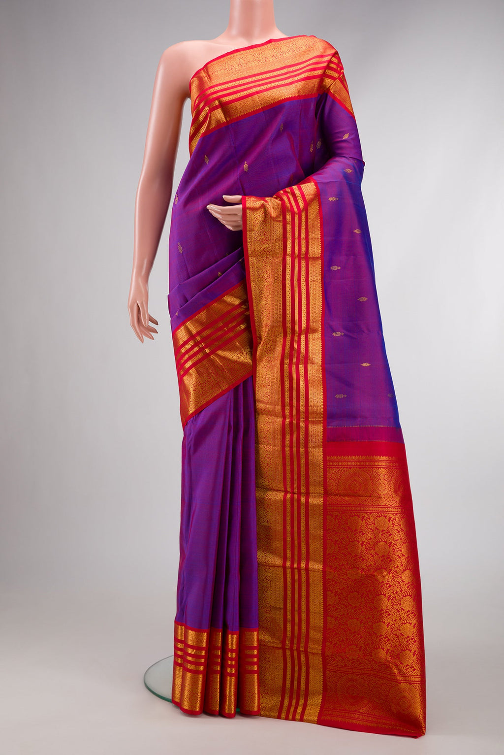 Purple Dual Tone Kanjivaram Silk Saree with Zari Butta on the body and Zari Border.  displayed on a mannequin