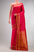 Pink with Red Color Kanjivaram Silk Saree with Zari Butta on the body and Zari Border.  displayed on a mannequin
