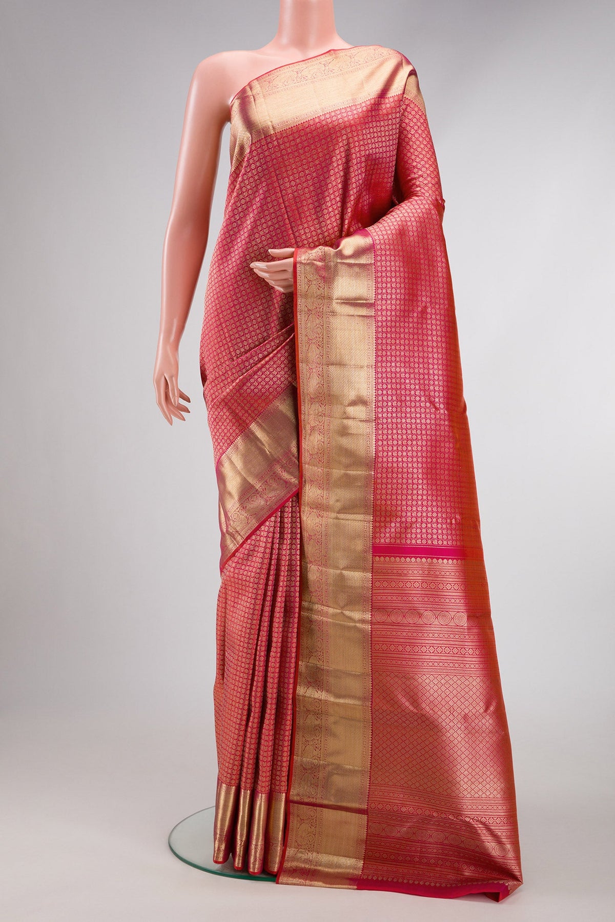Coral Dual Tone Kanchipuram Silk Saree with Zari Brocade on the body and Zari Border.  displayed on a mannequin