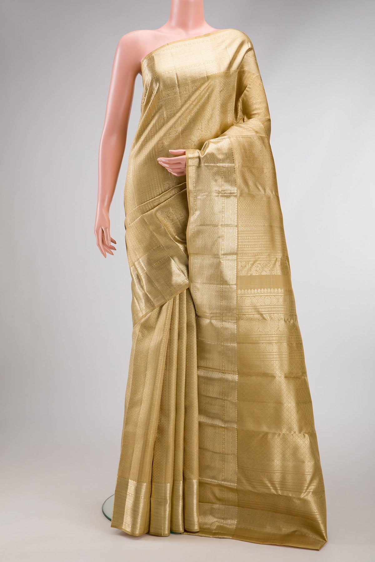 Dark Beige Dual Tone Kanchipuram Silk Saree with Zari Brocade on the body and Zari Border.  displayed on a mannequin