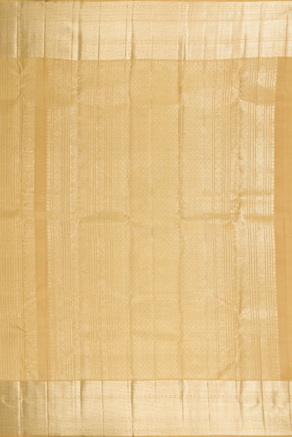 Close up image of the pallu of Dark Beige Dual Tone Kanchipuram Silk Saree with Zari Brocade on the body and Zari Border. 