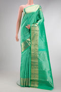 Sea Green Dual Tone Kanchipuram Silk Saree with Zari Brocade on the body and Zari Border.  displayed on a mannequin