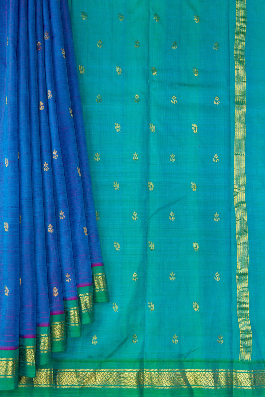 Pleats and pallu of Peacock Blue Dual Tone Kanjivaram Silk Saree with Zari Butta on the body and Zari Border. 